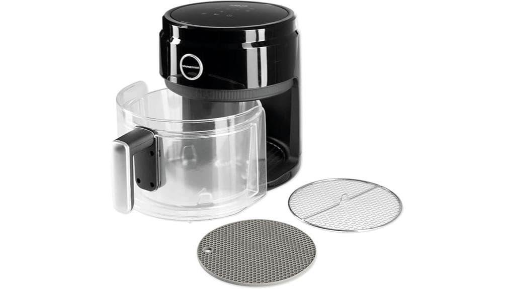 Eine schwarz-transparente GOURMETmaxx Heißluftfritteuse mit abnehmbarer Glasschüssel, einem Griff und zwei runden Metallrosten an der Vorderseite – ideal für gesundes Kochen und positive Bewertungen.