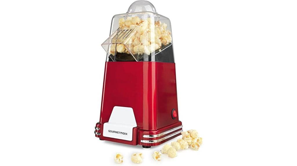 Eine rote GOURMETmaxx Popcornmaschine wirft frisch gepopptes Popcorn auf eine Oberfläche, wobei mehrere Popcornkörner um die Basis herum verstreut sind – perfekt für Ihren nächsten Testbericht oder Filmabend.